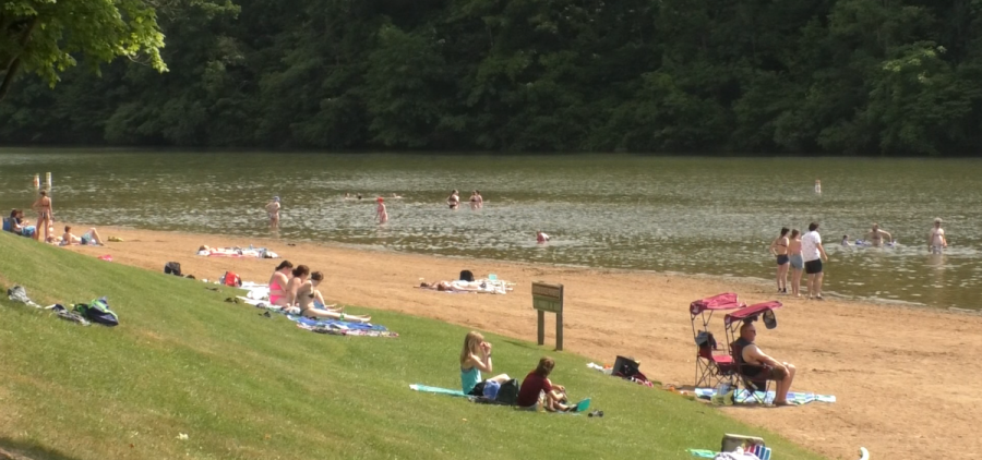 Lots of people at Strouds Run State Park enjoying the beach and water attractions.